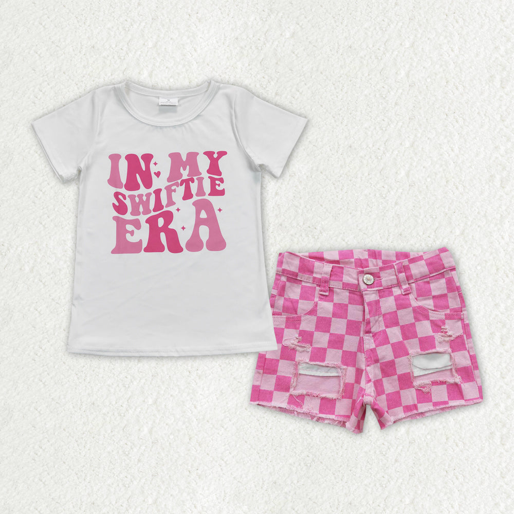 country music singer shirt pink checkerd jeans shorts outfit