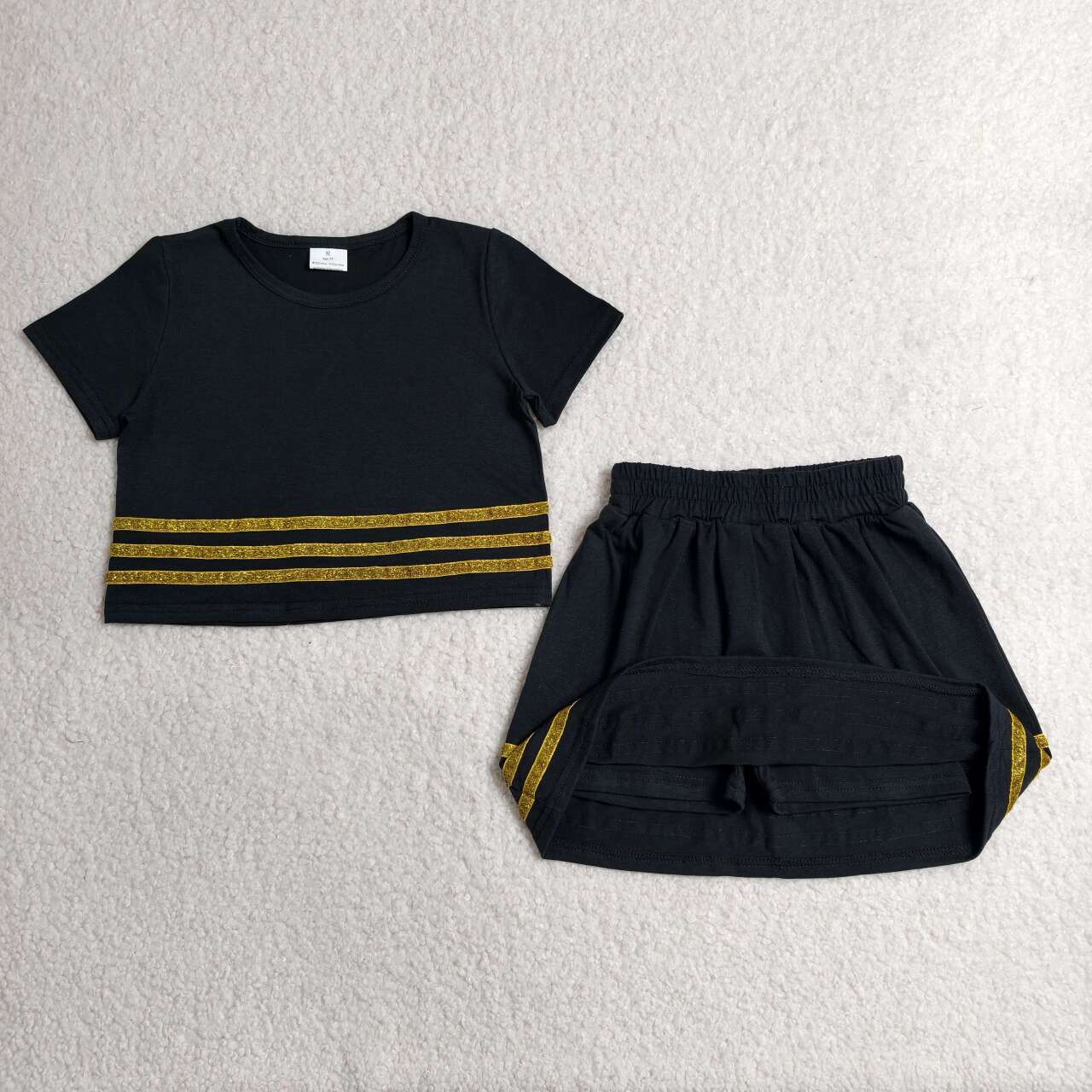 Black short sleeve top matching skort outfit