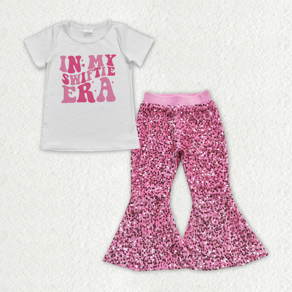 Country music singer shirt pink sequins bell bottoms outfit