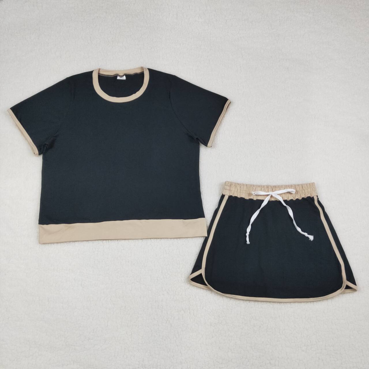 Adult women black color short sleeve skort set