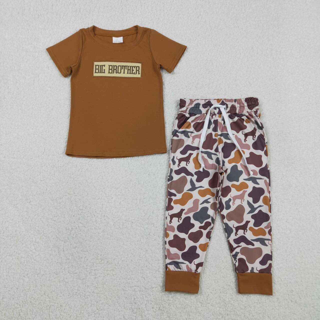 Big brother short sleeve top camo pants outfit