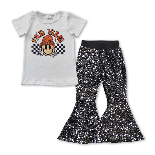 smile face short sleeve top black sequins pants outfit