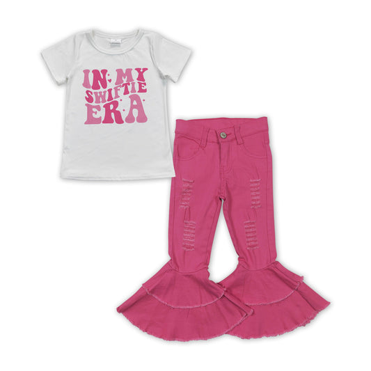 counrty music singer shirt hot pink jeans bell bottoms outfit