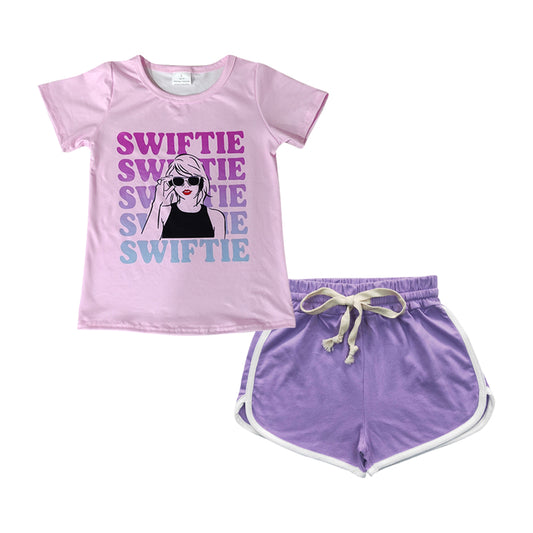 country music singer shirt lavender shorts outfit