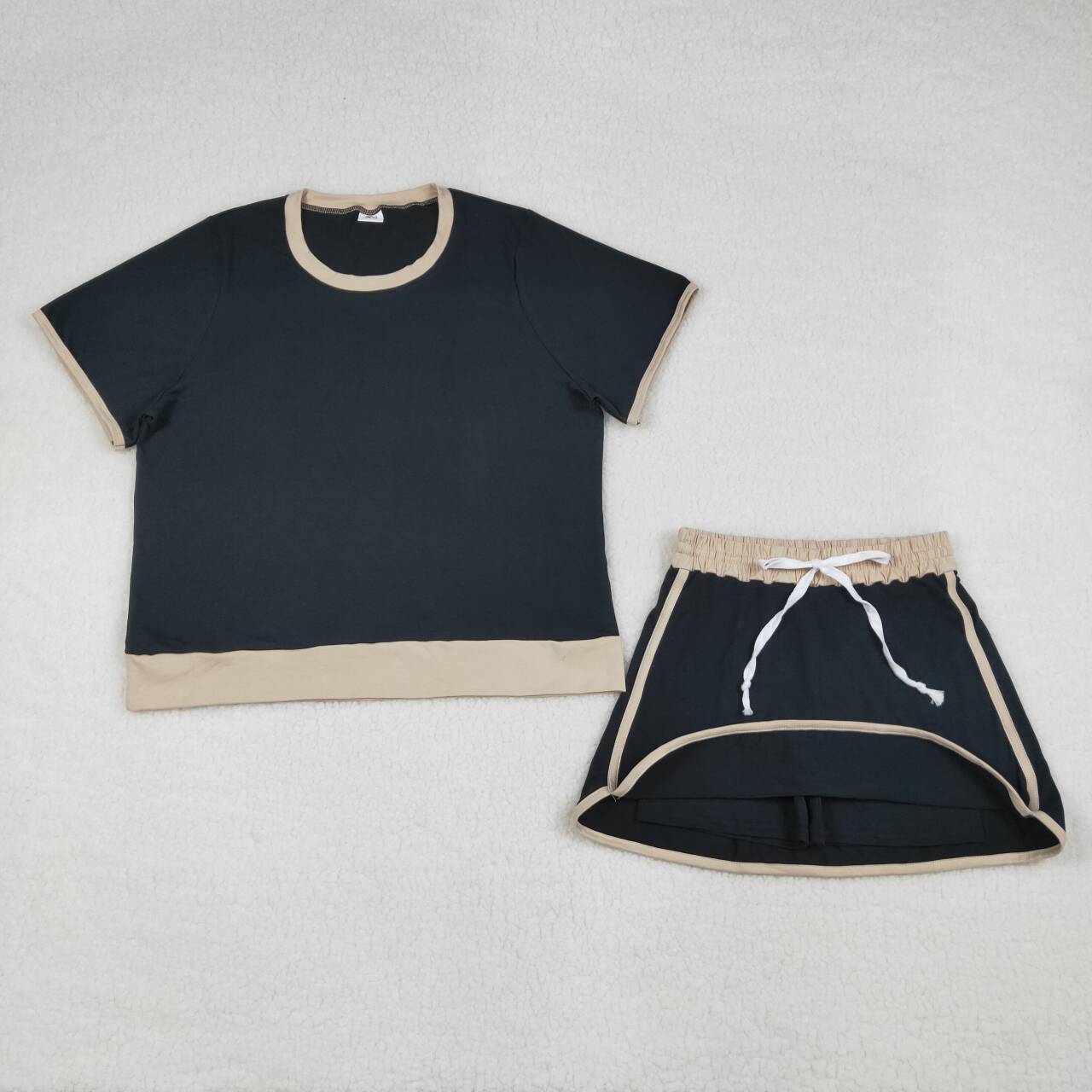 Adult women black color short sleeve skort set