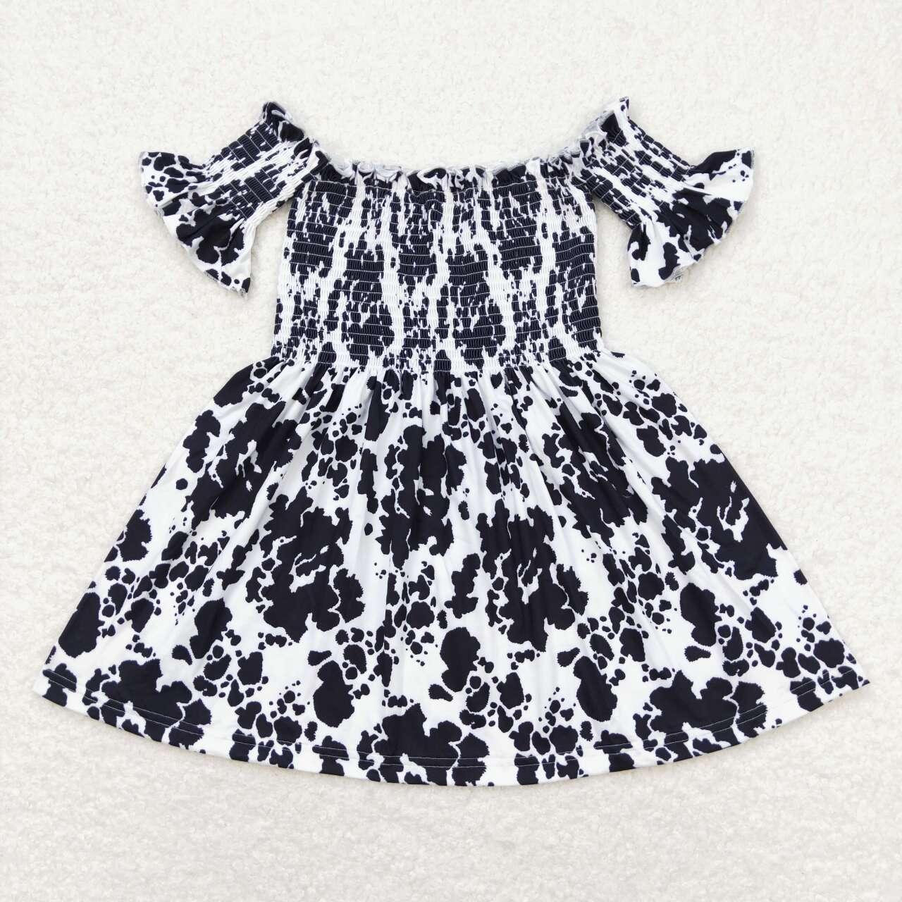 black cowhide smocked dress