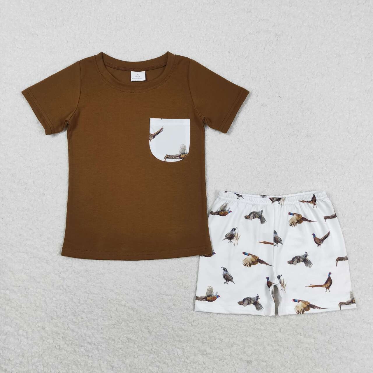brown pocket shirt forest bird shorts outfit
