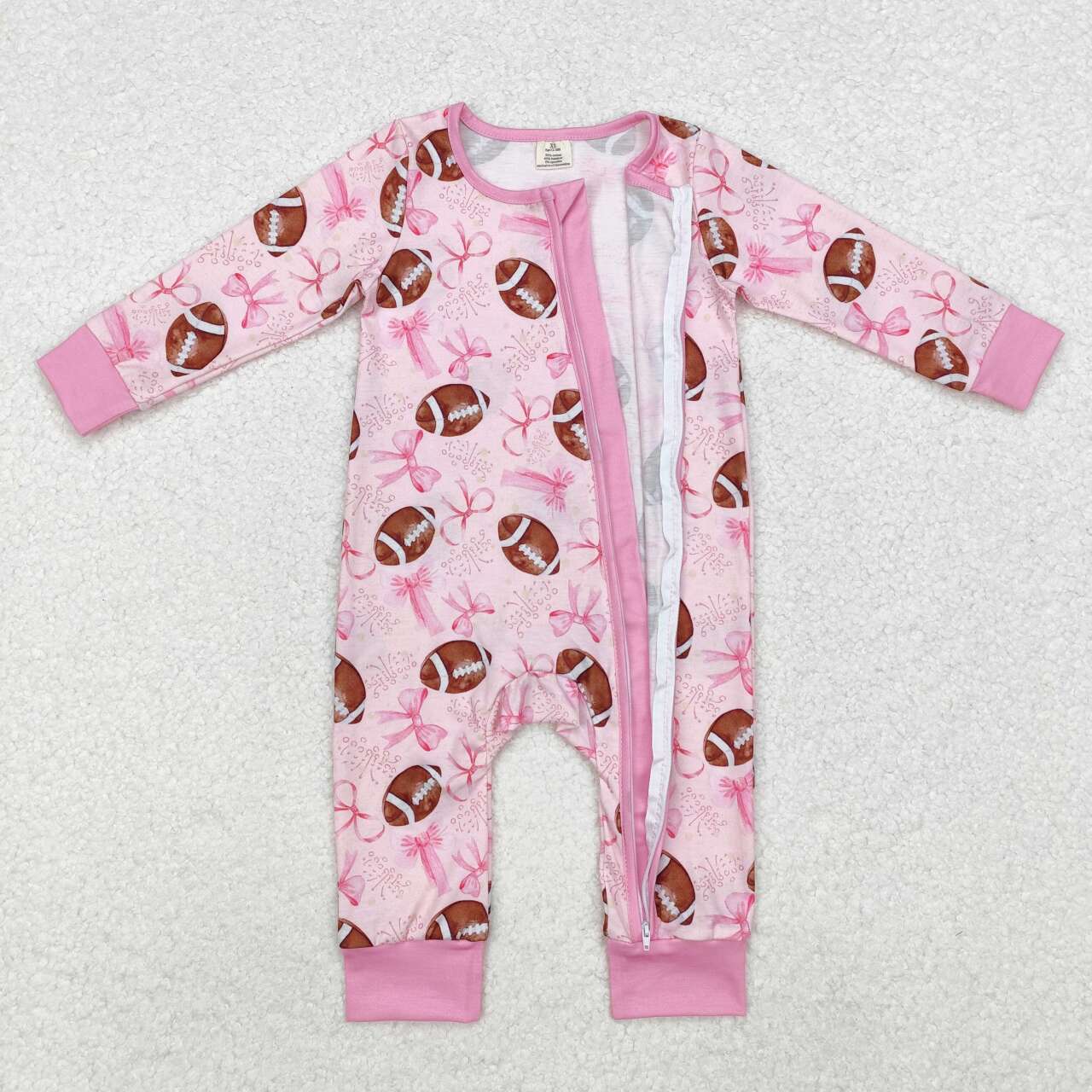 Football game day pink bow bamboo zip romper